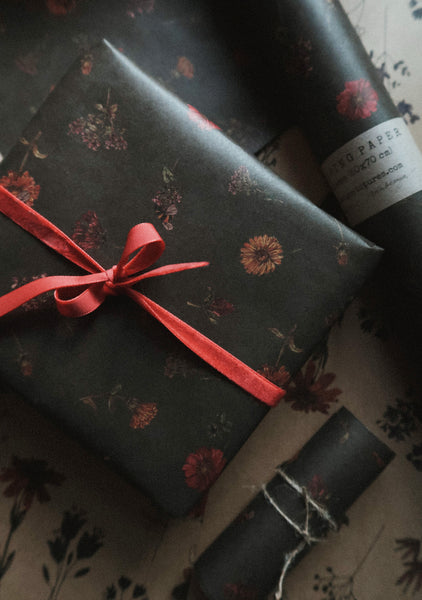 Florals on dark green kraft wrapping paper