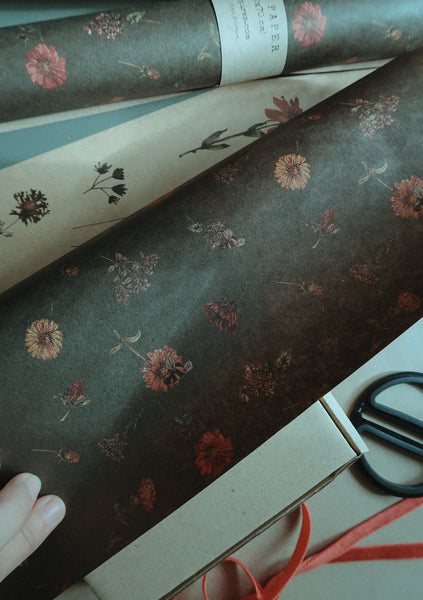 Florals on dark green kraft wrapping paper