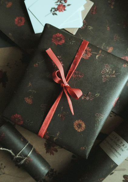 Florals on dark green kraft wrapping paper