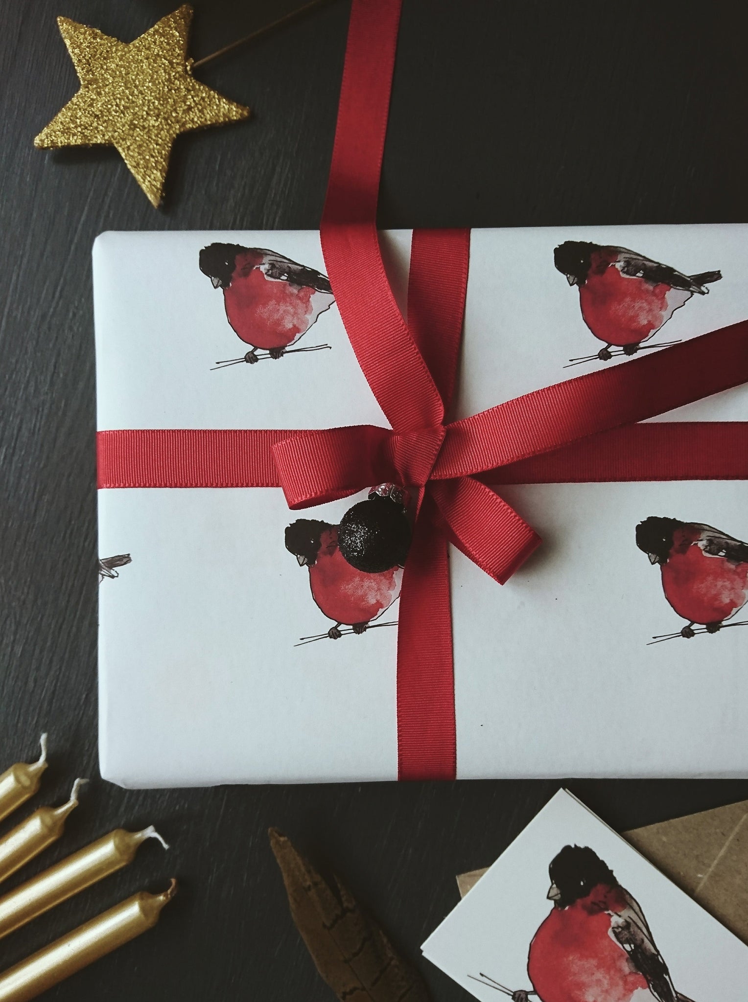 Red breasts pure white wrapping paper
